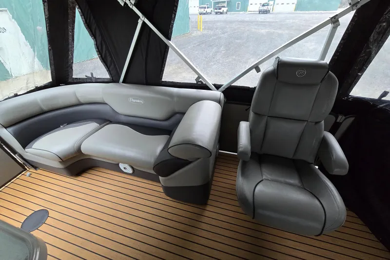 Slide: The Image of 2015 Premier 230 SunSation RF interior with gray seating and wood-style flooring. - 31