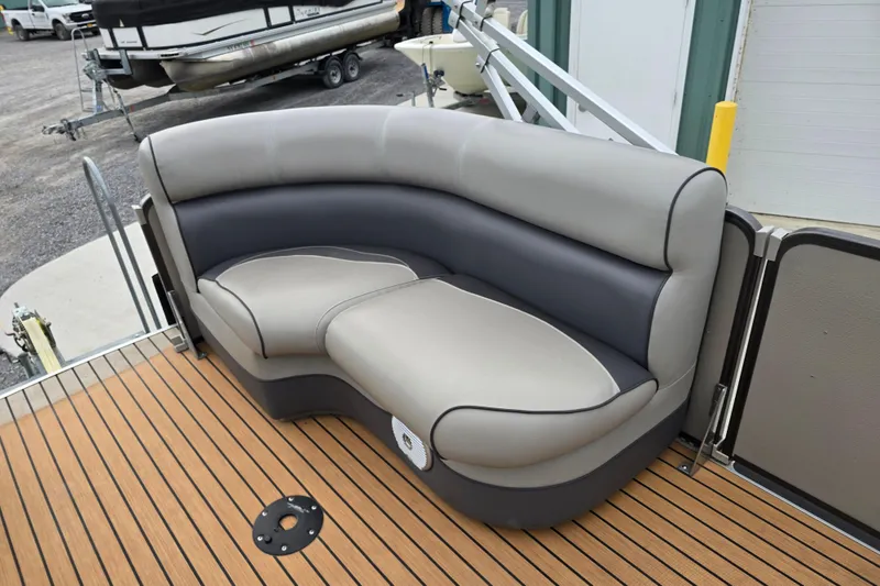Slide: The Image of 2015 Premier 230 SunSation RF boat with cushioned seating on teak deck. - 36