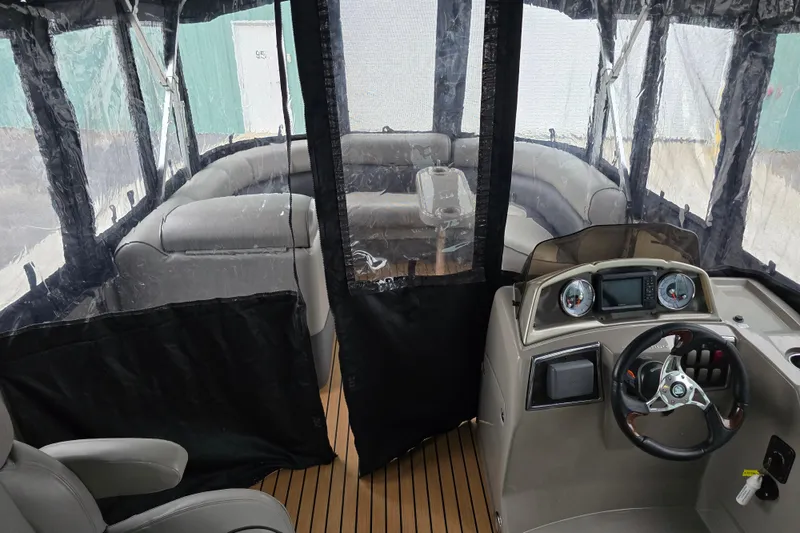 Slide: The Image of 2015 Premier 230 SunSation RF boat interior with seating and control panel. - 37