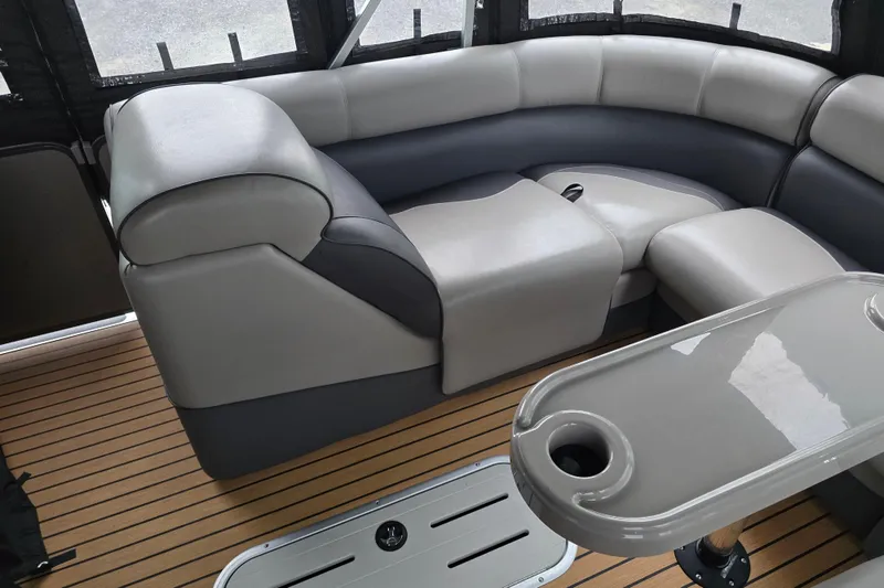 Slide: The Image of Luxurious seating area on 2015 Premier 230 SunSation RF pontoon boat with sleek table and flooring. - 40