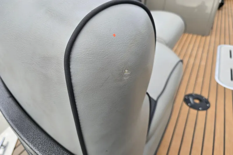 Slide: The Image of Close-up of a 2015 Premier 230 SunSation RF boat seat with minor wear. - 43