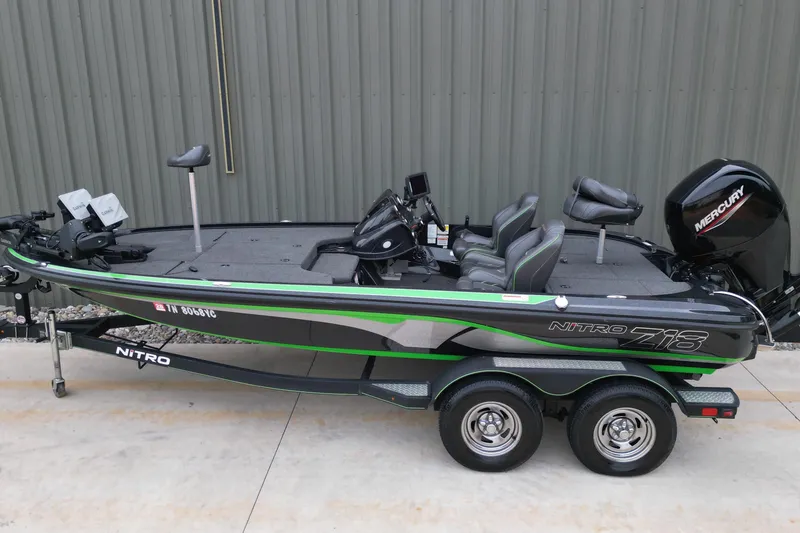 Slide: The Image of 2019 Nitro Z18 Pro fishing boat with Mercury engine, parked on a trailer. - 3