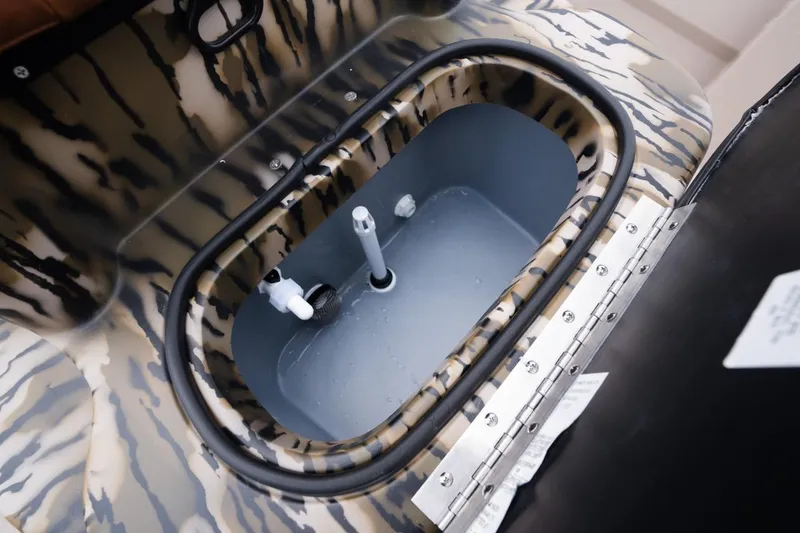 Slide: The Image of Livewell compartment in 2026 Avid 21 Recon boat with camouflage design. - 12