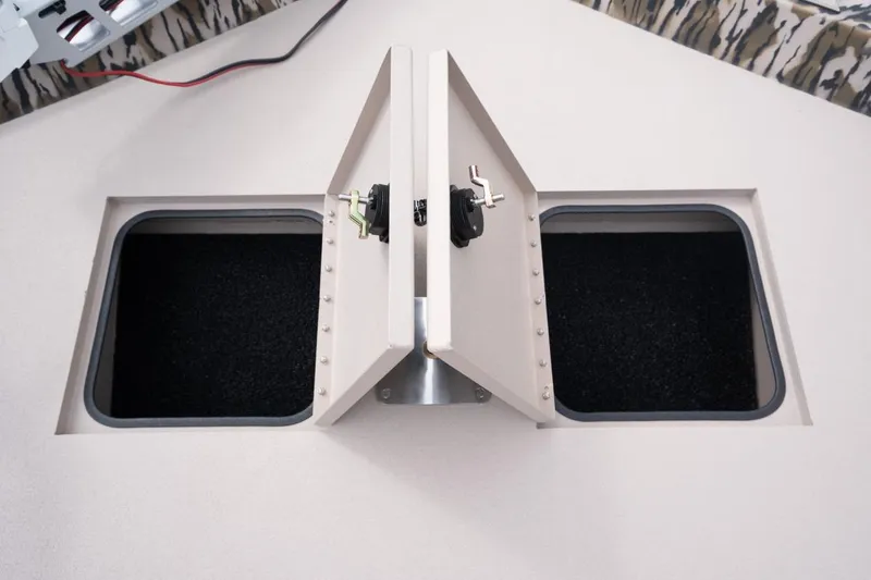 Slide: The Image of Dual storage compartments on 2026 Avid 21 Recon boat, featuring secure latches. - 6