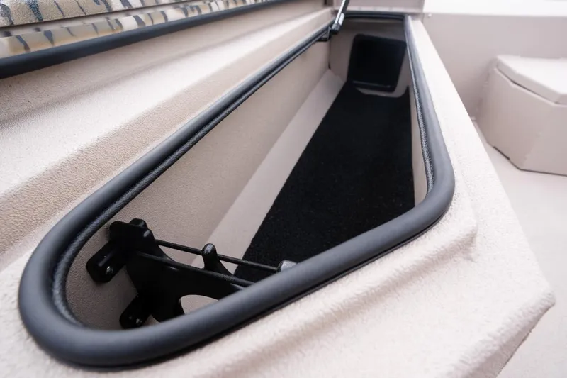 Slide: The Image of Avid 21 Recon 2026 boat storage compartment with sleek design and black trim. - 7