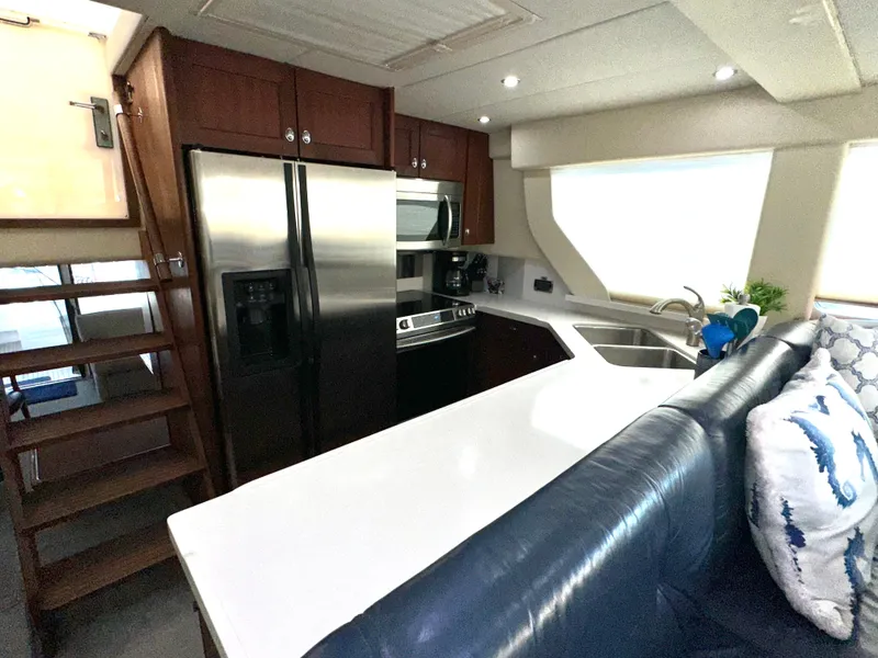Slide: The Image of 2003 Pacific Mariner 65 SE Motoryacht kitchen with stainless steel appliances and modern design. - 13