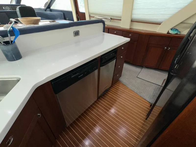 Slide: The Image of Luxurious kitchen interior of 2003 Pacific Mariner 65 SE Motoryacht with modern appliances. - 14