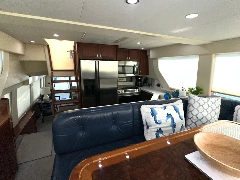 Slide: The Image of Interior of 2003 Pacific Mariner 65 SE Motoryacht with modern kitchen and seating area. - 19