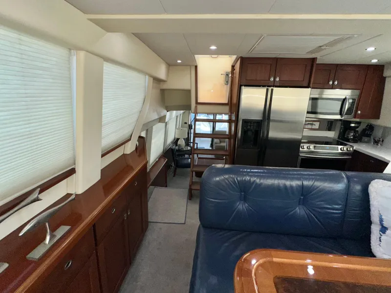 Slide: The Image of Interior of 2003 Pacific Mariner 65 SE Motoryacht with modern kitchen and seating area. - 20