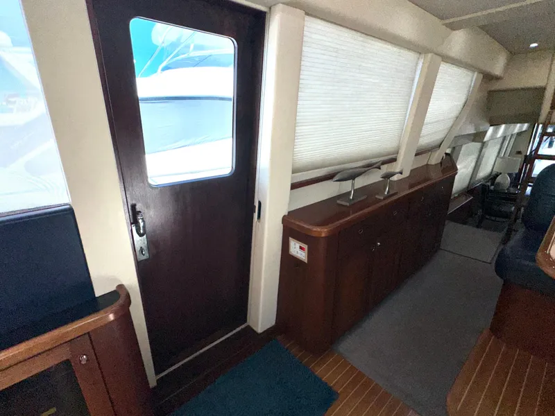 Slide: The Image of Interior view of 2003 Pacific Mariner 65 SE Motoryacht with wooden door and windows. - 22