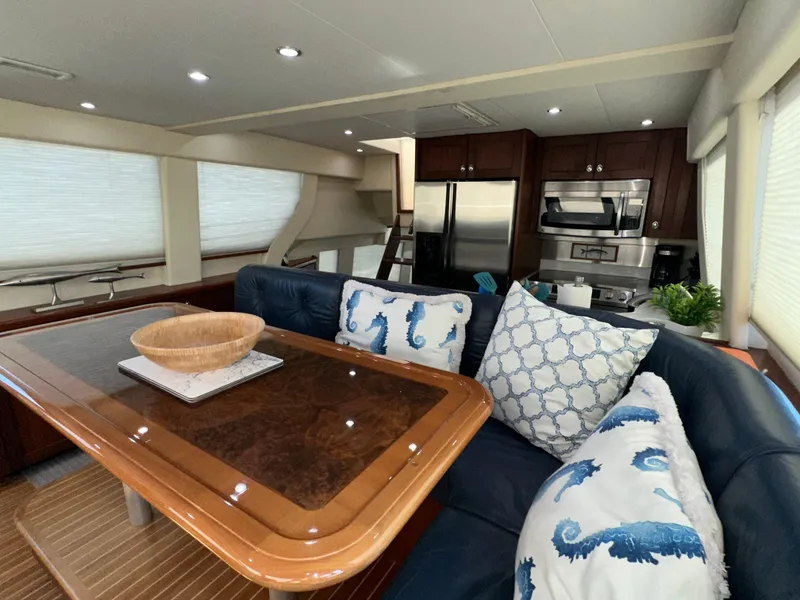 Slide: The Image of Luxurious interior of 2003 Pacific Mariner 65 SE Motoryacht with elegant dining area and modern kitchen. - 26