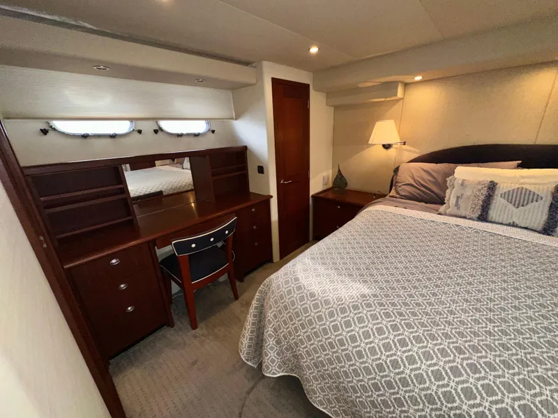 Slide: The Image of Luxurious bedroom in 2003 Pacific Mariner 65 SE Motoryacht with elegant decor and cozy bedding. - 35