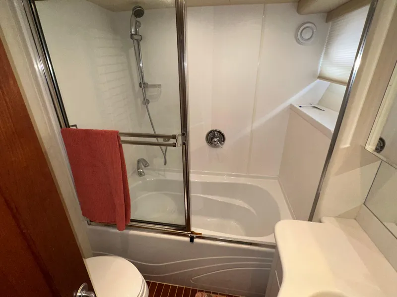 Slide: The Image of Bathroom in 2003 Pacific Mariner 65 SE Motoryacht with shower and red towel. - 39