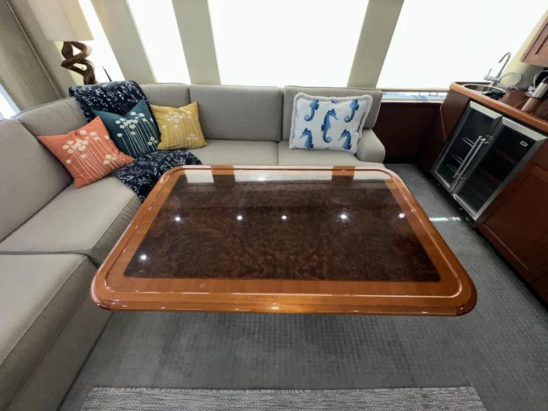Slide: The Image of Luxurious interior of 2003 Pacific Mariner 65 SE Motoryacht with elegant seating and decorative pillows. - 4