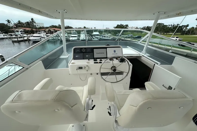 Slide: The Image of 2003 Pacific Mariner 65 SE Motoryacht helm with dual seats and navigation equipment. - 58