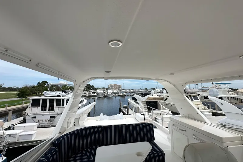 Slide: The Image of 2003 Pacific Mariner 65 SE Motoryacht docked in a marina, view from the deck. - 63