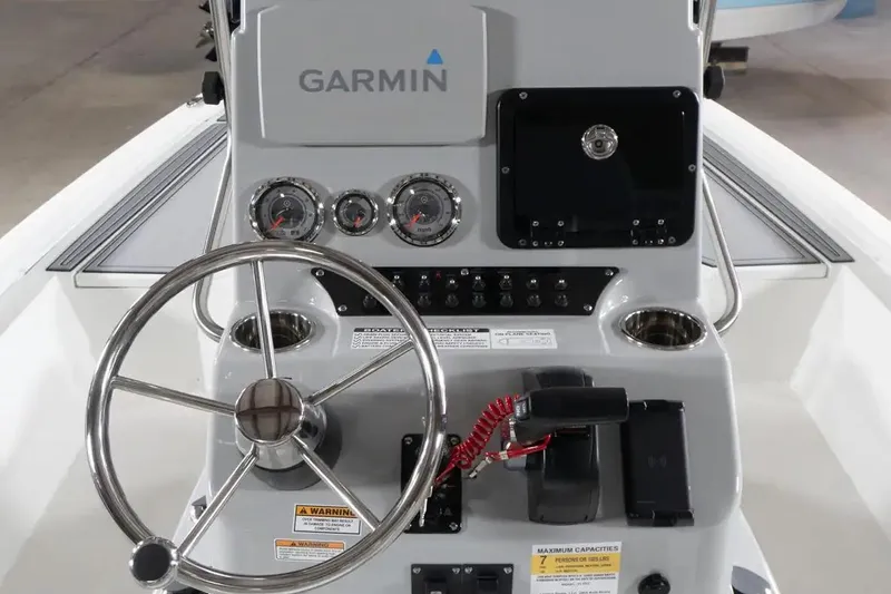 Slide: The Image of Steering console of 2026 Avid 21 FST boat with Garmin navigation system. - 2