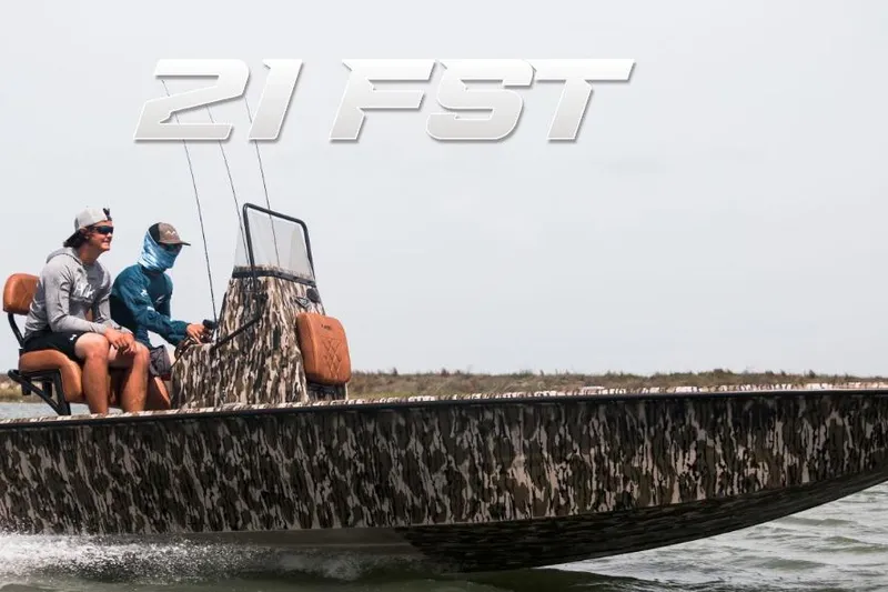 Slide: The Image of Avid 21 FST 2026 boat with camouflage design, two people onboard, cruising on water. - 4