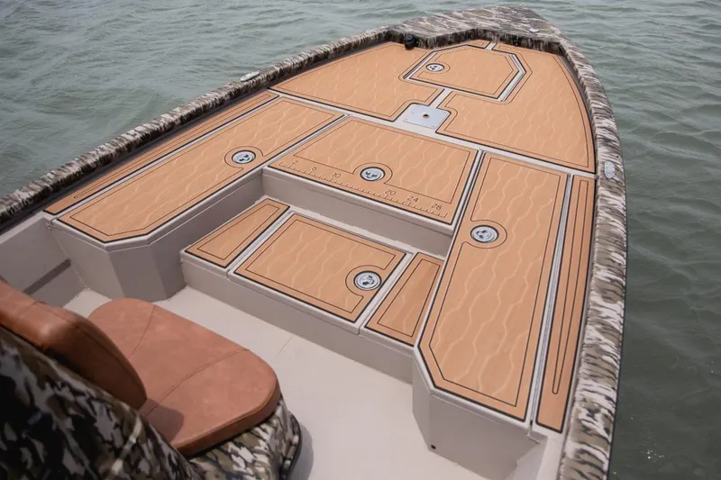 Slide: The Image of 2026 Avid 21 FST boat with sleek deck design on calm water. - 9