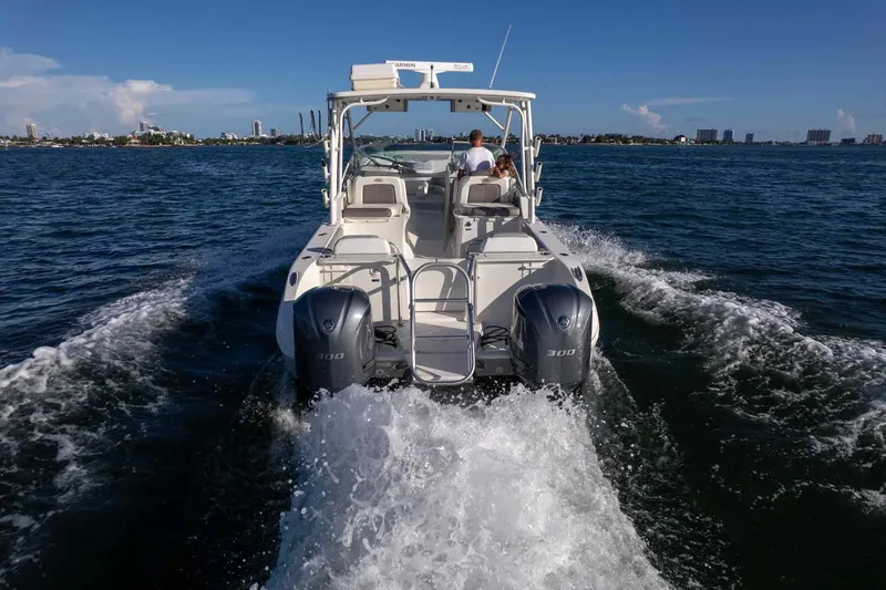 Slide: The Image of 2017 World Cat 295 DC cruising on open water with twin engines. - 10
