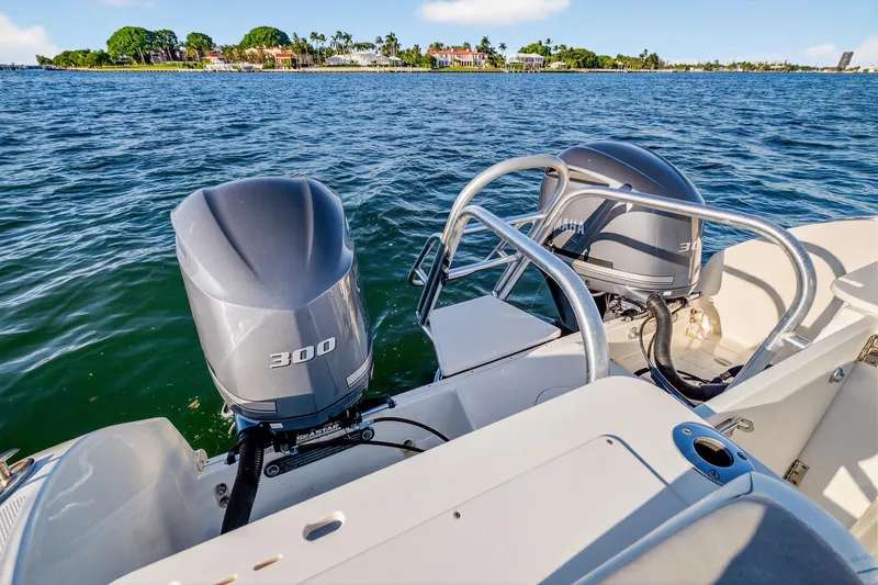 Slide: The Image of 2017 World Cat 295 DC boat with twin 300 horsepower Yamaha outboard engines on the water. - 13