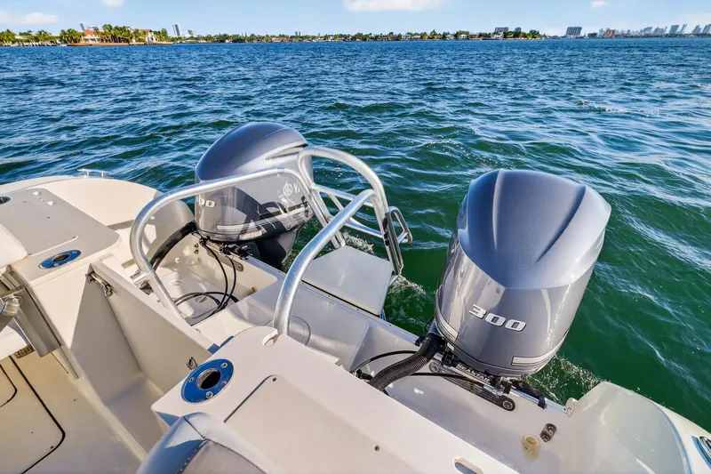 Slide: The Image of 2017 World Cat 295 DC boat with dual 300 horsepower engines on open water. - 14