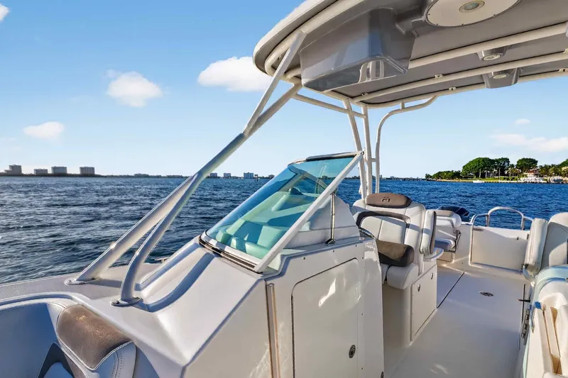Slide: The Image of 2017 World Cat 295 DC boat interior with ocean view and clear blue sky. - 23