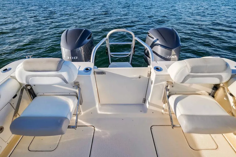 Slide: The Image of 2017 World Cat 295 DC boat with dual 300 horsepower engines on open water. - 30