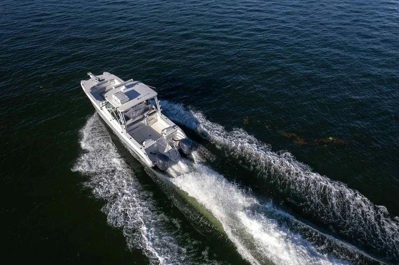 Slide: The Image of 2017 World Cat 295 DC cruising on open water, aerial view. - 41