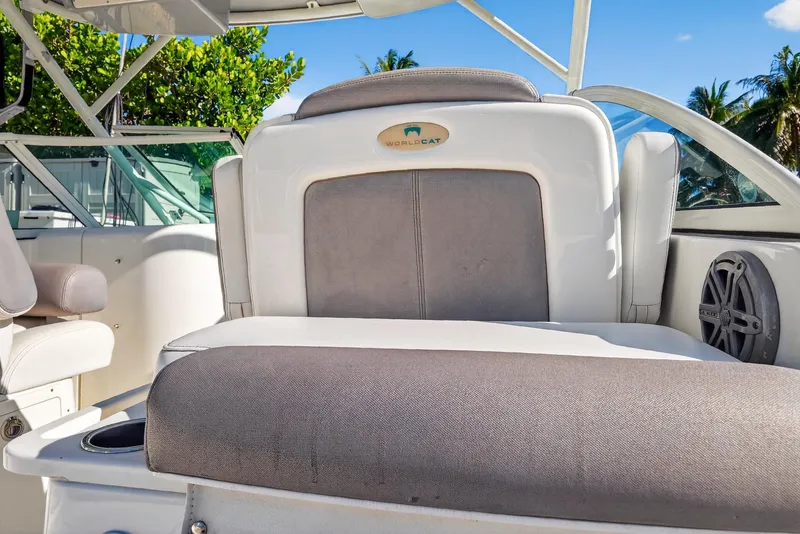 Slide: The Image of 2017 World Cat 295 DC boat interior with cushioned seating and speaker. - 42