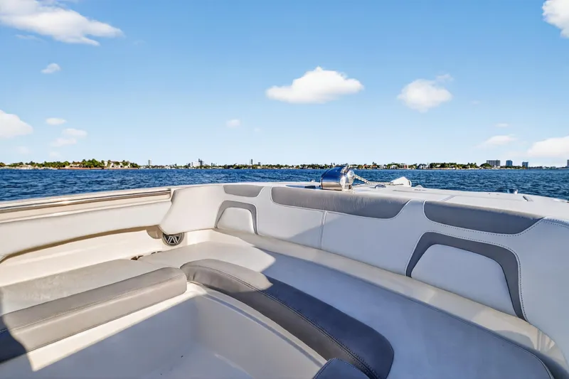 Slide: The Image of 2017 World Cat 295 DC boat interior with ocean view and clear blue sky. - 45