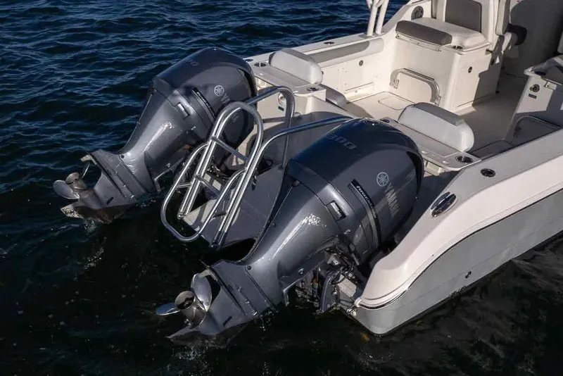 Slide: The Image of 2017 World Cat 295 DC boat with dual outboard engines on water. - 8