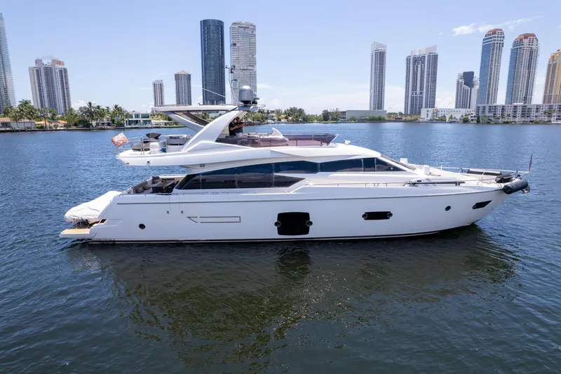 The Image of 2015 Ferretti Yachts 750 on water with city skyline in background. - 0