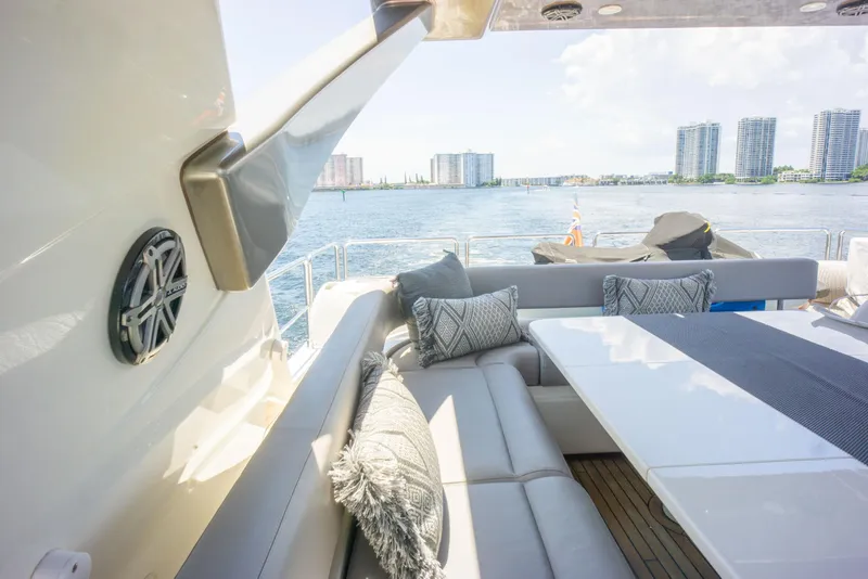 Slide: The Image of Luxurious seating area on a 2015 Ferretti Yachts 750 with waterfront city views. - 20