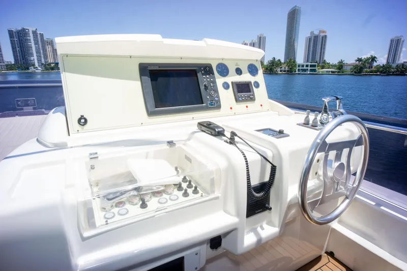 Slide: The Image of Control panel of a 2015 Ferretti Yachts 750 with city skyline in the background. - 22