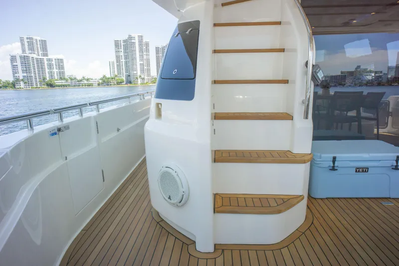 Slide: The Image of Luxurious 2015 Ferretti Yachts 750 deck with wooden stairs and waterfront view. - 23