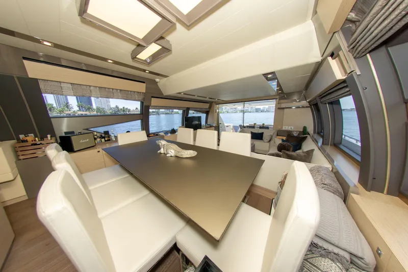 Slide: The Image of Luxurious interior of 2015 Ferretti Yachts 750 with elegant dining area and panoramic windows. - 42