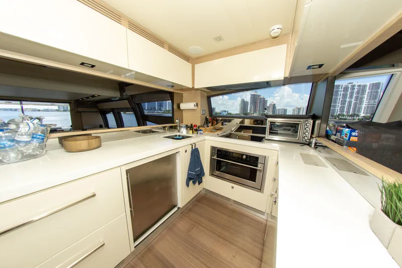 Slide: The Image of Modern kitchen interior on a 2015 Ferretti Yachts 750, featuring sleek cabinetry and appliances. - 44
