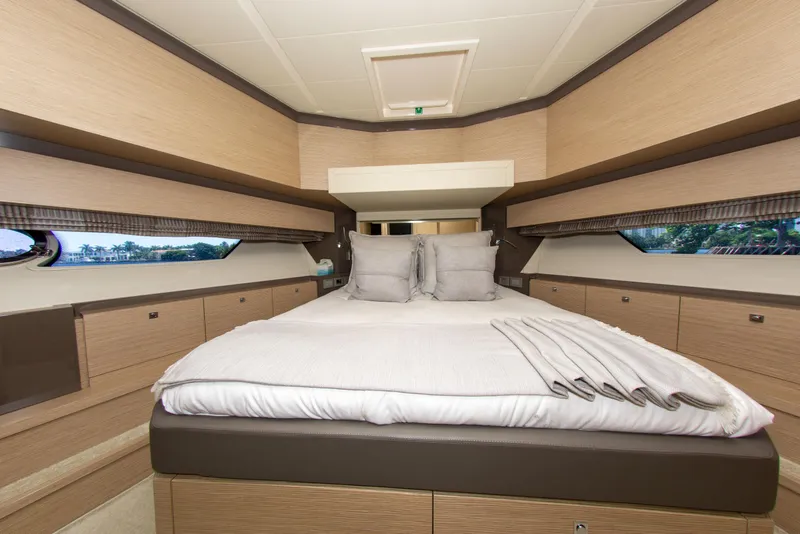 Slide: The Image of Luxurious bedroom interior of 2015 Ferretti Yachts 750 with elegant bedding and panoramic windows. - 49