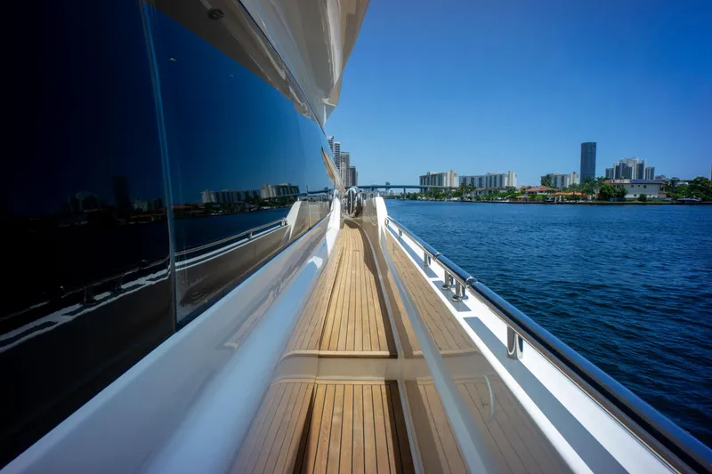 Slide: The Image of 2015 Ferretti Yachts 750, sleek deck view, city skyline, blue sky, waterfront. - 6