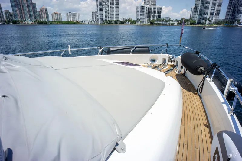 Slide: The Image of Ferretti Yachts 750 (2015) on water, showcasing deck and city skyline in background. - 7