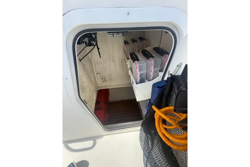 Slide: The Image of 2018 Steiger Craft 23 boat storage area with organized tackle boxes and equipment. - 4