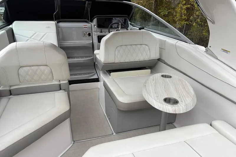 Slide: The Image of 2021 Regal 26 Express boat on dry dock, showcasing sleek design and powerful engine. - 9