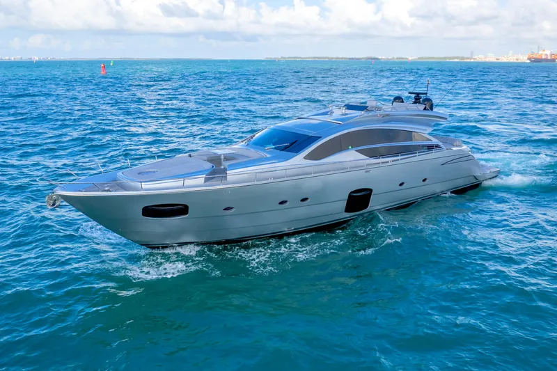 The Image of Luxurious 2013 Pershing 82 yacht cruising on open blue sea under clear skies. - 0