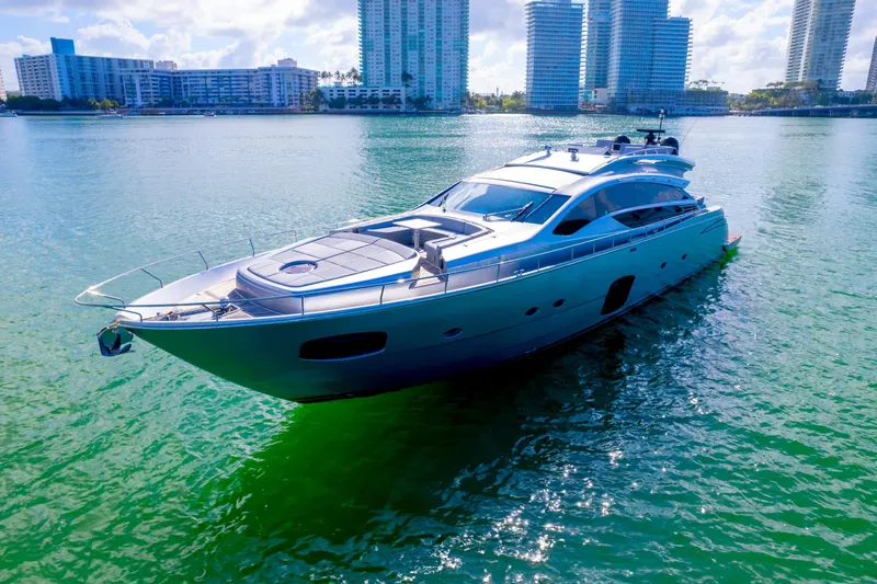 Slide: The Image of Luxurious 2013 Pershing 82 yacht cruising in a scenic waterfront cityscape. - 13