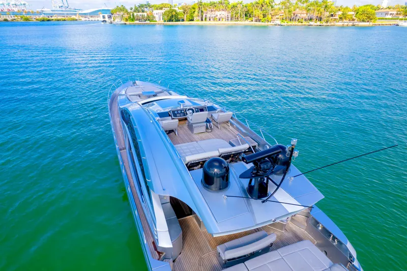 Slide: The Image of Luxurious 2013 Pershing 82 yacht on serene blue waters, showcasing sleek design and modern amenities. - 19