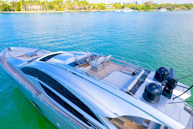 Slide: The Image of Luxurious 2013 Pershing 82 yacht on serene blue waters, showcasing sleek design and spacious deck. - 20