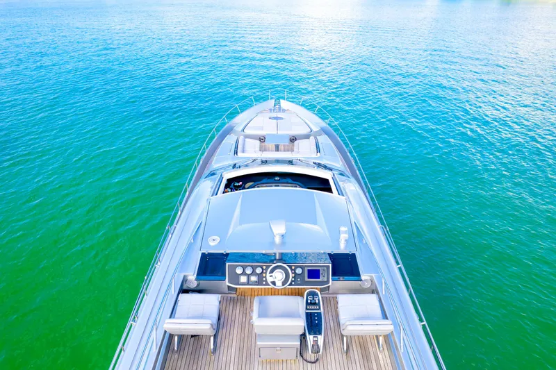 Slide: The Image of Luxury 2013 Pershing 82 yacht on serene blue-green water. - 21