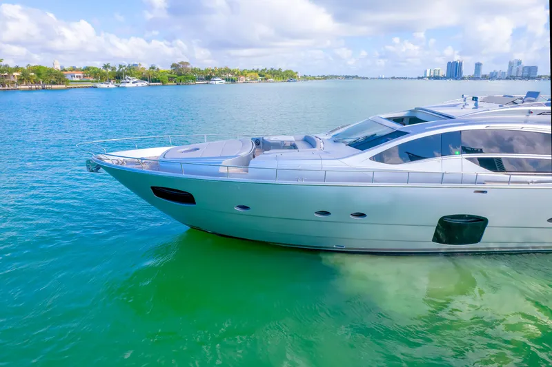 Slide: The Image of Luxury 2013 Pershing 82 yacht on clear blue water, sunny day, coastal skyline. - 24