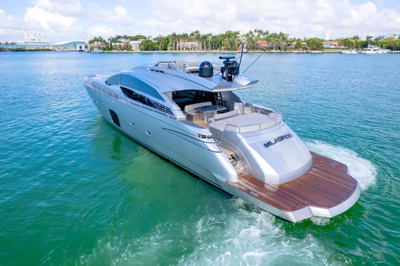 Slide: The Image of Luxury 2013 Pershing 82 yacht cruising on clear blue water. - 25